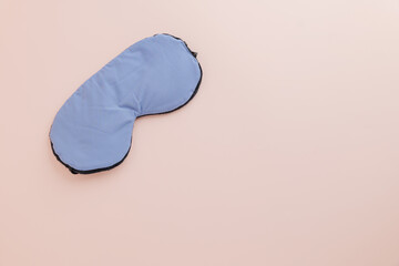 Celebrate World Sleep Day with a stylish sleep mask on pink background. Promoting Sleep Day awareness