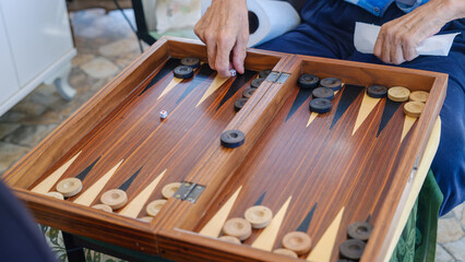 A close-up view of the game pieces and dice of the traditional board game, backgammon