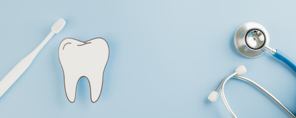 Dentist Day highlights a paper tooth, toothbrush, and mirror for a dental check