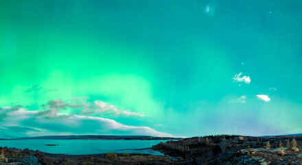 Naklejka premium Aurora borealis over Lagerfljot River in Iceland - panorama