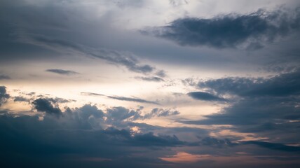 Fototapeta premium Dramatic Cloudscape: A breathtaking scene of a dramatic cloudscape. Storm clouds drift across the horizon, painted with light. Capturing the sublime beauty and the ethereal feel