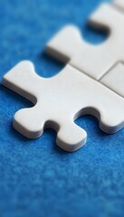 Obraz premium White puzzle pieces on a textured blue background