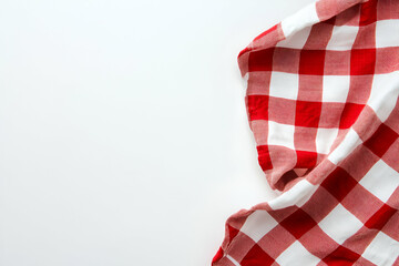 Elegant composition featuring a red and white checkered tablecloth on a clean white background, perfect for culinary projects or seasonal promotions