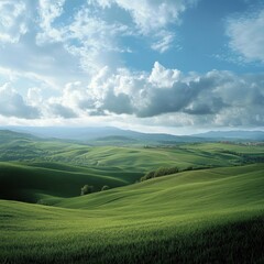 Fototapeta premium Rolling green hills under a partly cloudy sky.
