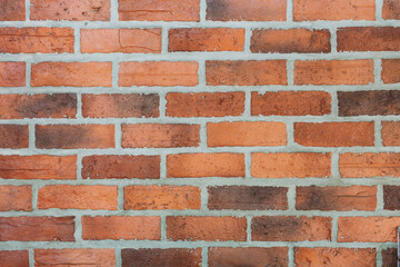 Obraz premium Red-brown brick wall is suitable for making a background.