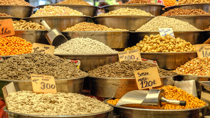 Various colorful organic snacks displayed openly on a bazaar stall