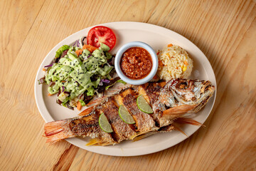 Fried fish with salad
