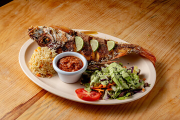 Fried fish with salad