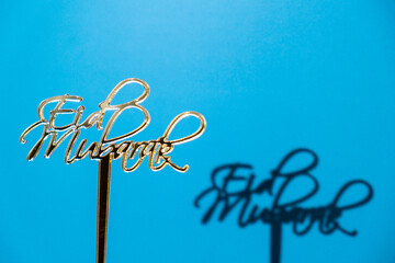 Traditional Islamic holiday greetings Eid Mubarak. Ramadan Kareem concept background. Creative light and shadows sunset lamp lantern. Muslim holiday poster Eid-Ul-Adha festival celebration