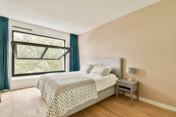 A cozy modern bedroom featuring a large window that opens outward. The room is styled with neutral tones and a comfortable bed for relaxation.