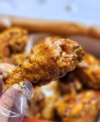 Crispy Korean fried chicken, perfectly glazed with a sweet and spicy sauce. Ideal for food photography and menus, showcasing the irresistible crunch and flavor of this beloved dish.
