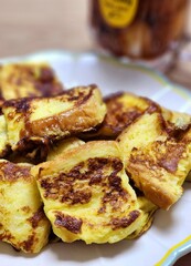Golden, crispy toast topped with butter and jam, perfect for breakfast or snack-related projects. This image captures the warmth and comfort of a simple yet satisfying meal.

