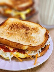 Delicious sandwich filled with fresh ingredients like crisp vegetables, tender meats, and savory spreads, all between two slices of soft bread. Perfect for a quick and satisfying meal.
