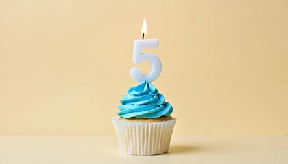 Blue Frosted Cupcake Featuring Lit Number 5 Candle, Celebrating Birthdays in Minimalistic Style on Beige Backdrop with Elegance and Sweet Charm for Special Occasions