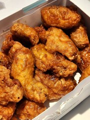 Crispy Korean fried chicken, perfectly glazed with a sweet and spicy sauce. Ideal for food photography and menus, showcasing the irresistible crunch and flavor of this beloved dish.
