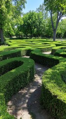 A green labyrinth path leads through a structured hedge garden