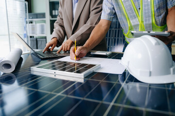 Two engineers collaborate on solar and wind energy, driving clean innovation and sustainability. A vision of teamwork