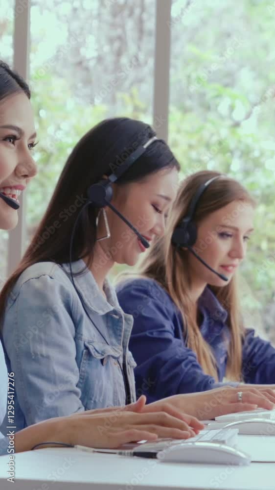 Poster customer support agent or call center with headset works on desktop computer while supporting the cu