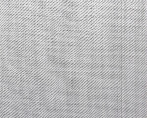 A close-up of a textured gray fabric, showcasing a subtle pattern that adds depth and interest to the surface.