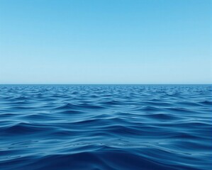 Fototapeta premium A serene ocean view under a clear blue sky, showcasing gentle waves and a peaceful horizon.