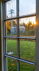 Fototapeta premium A window reveals a landscape bathed in late afternoon light