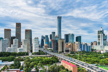 The Guomao architectural complex in Beijing, China, under the blue sky and white clouds