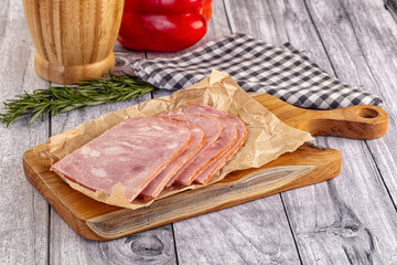 Sliced porjk ham over boatd