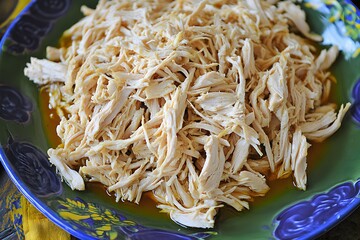 Delicious Shredded Chicken Dish on Plate, Closeup Food Photography
