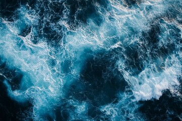 Obraz premium Top down view of ocean waves in dark blue and white colors, hyper realistic photography capture