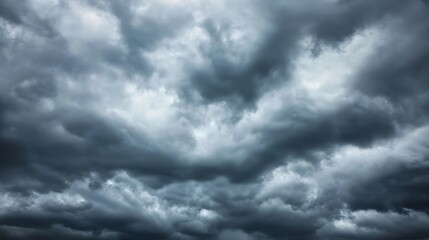 Dramatic stormy clouds looming over a darkened sky creating a moody atmosphere : Generative AI