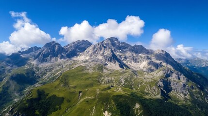 Fototapeta premium Majestic aerial view of rugged mountains under clear blue sky surrounded by lush greenery : Generative AI