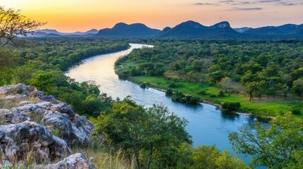 Serene Sunset River Landscape Tranquil Water Winding Through Lush Green Valley