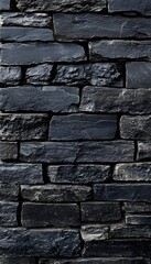 Naklejka premium Stacked dark gray stone wall showing rough texture and pattern