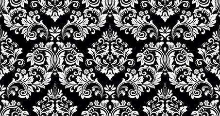 Wallpaper in the style of Baroque. White and black floral ornament. Seamless vector background. Graphic pattern for fabric, wallpaper, packaging. Ornate Damask flower illustration.