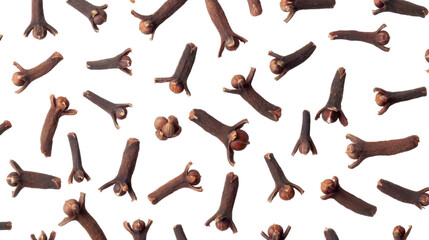 Dried cloves falling on transparent background: spice pattern for culinary designs