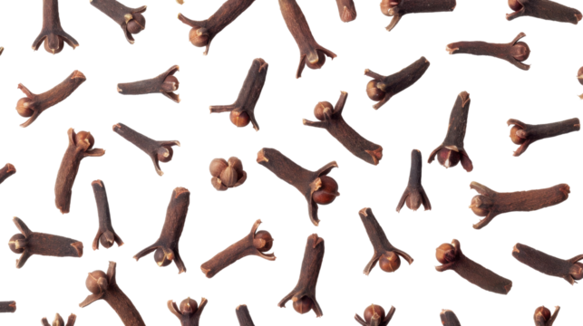 Dried cloves falling on transparent background: spice pattern for culinary designs