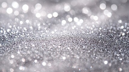 Shimmering silver glitter surface with bokeh lights creating a festive and elegant background perfect for holiday themes and celebrations