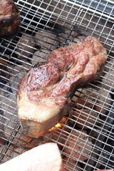 Thick pork shoulder grilled over charcoal. Cooked in Korean style barbecue.