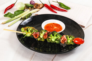 Thai Street foof satay with bacon and broccoli