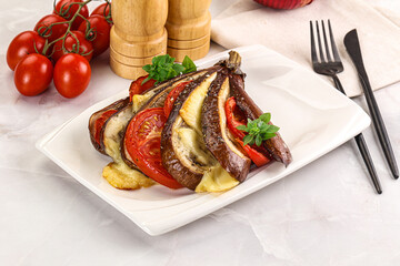 Baked tomato with mozzarella and tomato