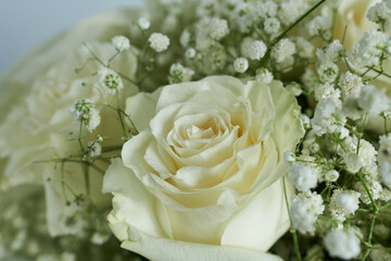 Bridal bouquet of white roses and gypsophila. Close-up.