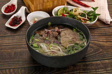 Vietnamese Pho Bo soup with beef and noodles