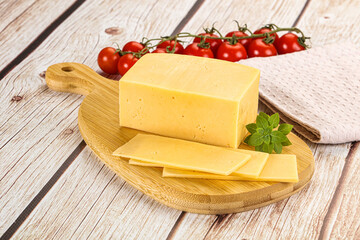 Yellow cheese piece with slices