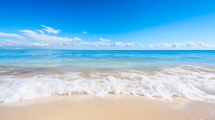 Fototapeta premium Calm ocean waves gently rolling onto a sandy beach under a bright blue sky with fluffy white clouds : Generative AI