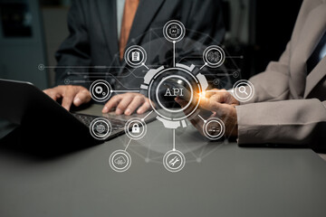 Modern technology and networking concept, businessman using laptop,tablet and smartphone with virtual screen API icon Software development tool. Application Programming Interface.