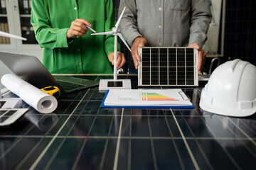 Fototapeta premium Two colleagues discussing data working and tablet, laptop with on Construction Site project.