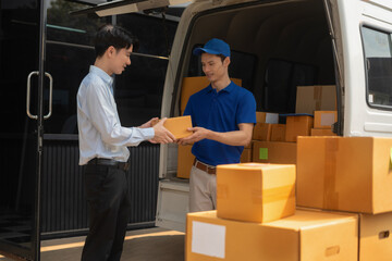 Asian delivery man delivers parcel to a customer at home office, fast shipping, e-commerce.