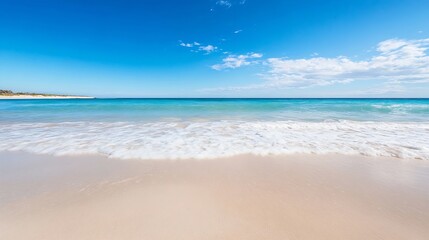 Obraz premium Scenic View of Clear Blue Ocean and Sandy Shore Under Bright Sky : Generative AI