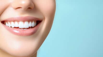 Fototapeta premium Oral care gum protection essential. Close-up of a smiling woman with bright, white teeth against a blue background.