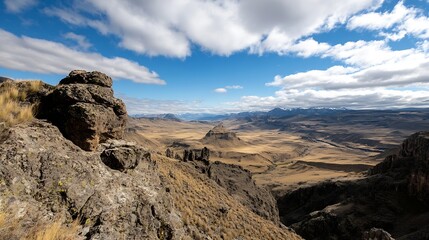 Obraz premium Breathtaking mountain landscape showcasing rugged terrain and dramatic clouds across vast plains : Generative AI